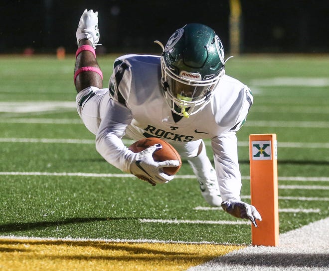 Trinity's Wynton Johnson makes this diving touchdown in the first quarter against rival St. X at Brother Thomas More Stadium Friday night. Oct. 2, 2020