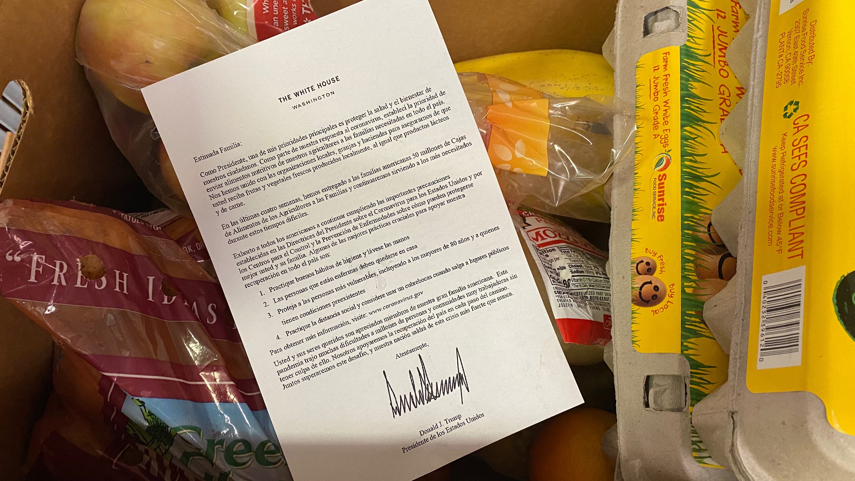 Nonprofit responds to food boxes including letter signed by Trump