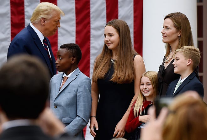 President Donald Trump, Supreme Court nominee Amy Coney Barrett and some of her children at the White House on Sept. 26, 2020.