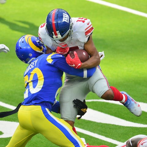 Giants receiver Golden Tate is tackled by Rams cor