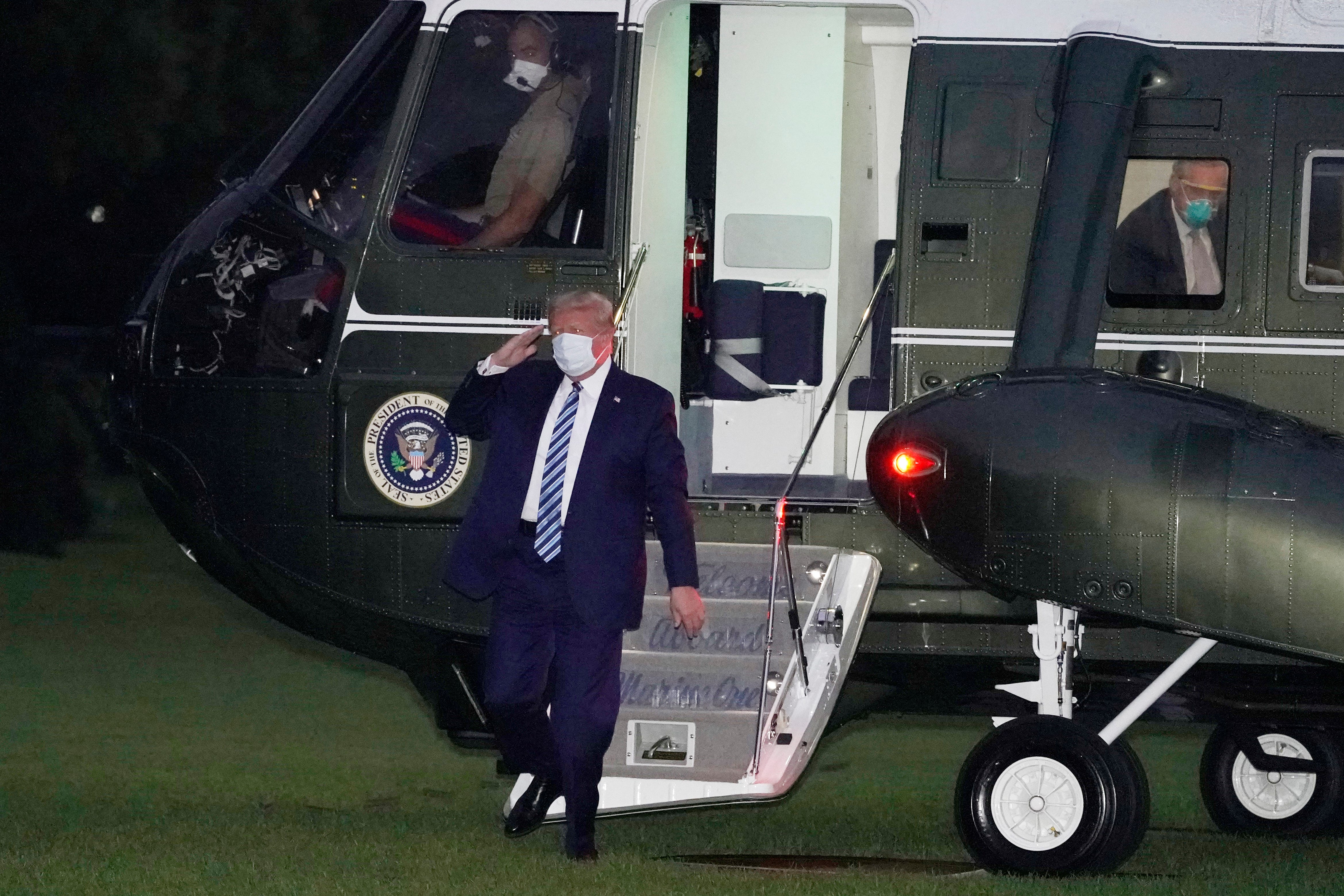 President Donald Trump returns to the White House on Oct. 5 after leaving Walter Reed National Military Medical Center in Bethesda, Md. Trump announced he tested positive for COVID-19 on Oct. 2.