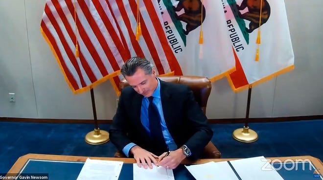 This Wednesday, Sept. 30, 2020, in a file image created from video from the California Governor's Office, Gov. Gavin Newsom establishes a task force to develop recommendations on how to provide compensation to black Americans. sign the billsacramento, california