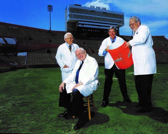 Four of the doctors credited with inventing Gatorade are shown decades later -- Dr. Robert Cade (sitting) and his medical fellows Dr. Alex de Quesada, Dr. Dana Shires,   and Dr. Jim Free.
