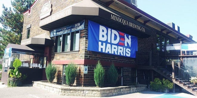 Minocqua Brewing owner Kirk Bangstad put up a large Biden sign and the county wants him to take it down.