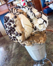 The Cookie Dough Wild Shake from Sparta Classic Diner comes with a full chocolate chip ice cream cookie sandwich on top.