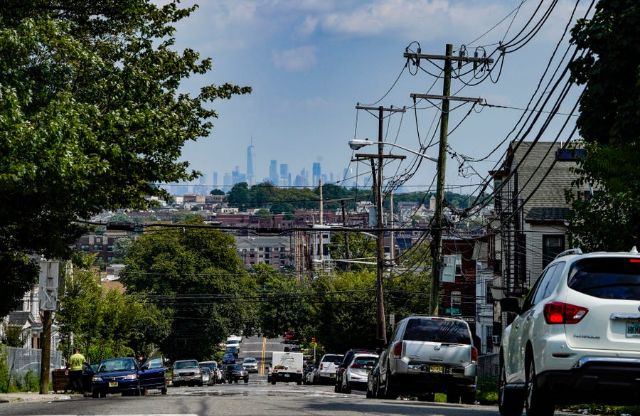 The Newark skyline seen from a neighborhood in East Orange on Tuesday, Aug. 25, 2020. Communities of color have been hit hard by the COVID-19 pandemic with high case counts and deaths in Newark, N.J., the most populous city in the state and the heart of Essex county.
