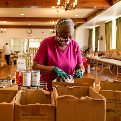 Brenda Blount, 55, of Newark, helps volunteers at 
