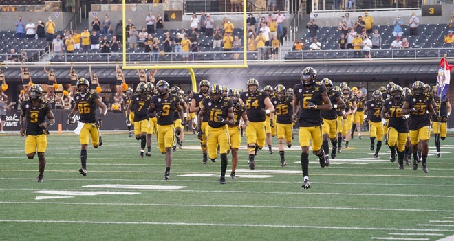 Missouri football players take Faurot Field prior to the season opener against Alabama. The Tigers weren't scheduled to return home until Oct. 17 but the Southeastern Conference is expected to announce Wednesday morning that it is moving Saturday's scheduled game at LSU to Columbia because of the impending effects of Hurricane Delta.