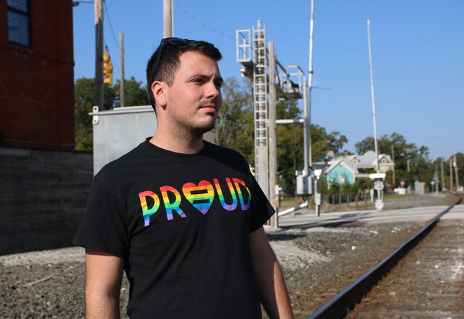 David Haider looks out at downtown Kinston Wednesday, Sept. 7, while wearing a "Proud" shirt during LGBT History Month. [Brandon Davis/Kinston Free Press]