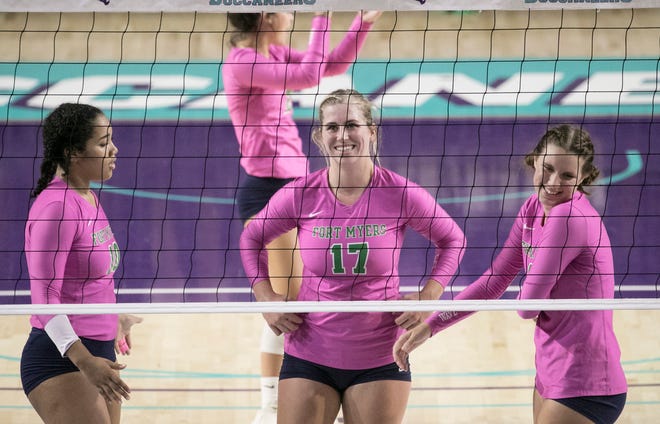 Paris Thompson, center, smiles as she is recognized for breaking the school record for killings at the Suncoast Credit Union Arena at Florida SouthWestern State College in Fort Myers on Tuesday, October 6, 2020.