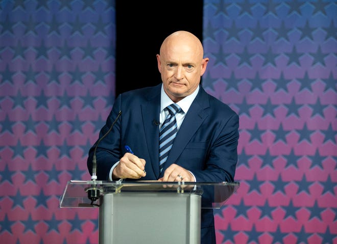 Democratic challenger Mark Kelly prepares to debate Republican Sen. Martha McSally at the Walter Cronkite School of Journalism at Arizona State University on Oct. 6, 2020.