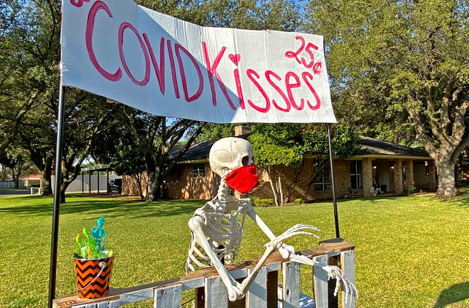 Skeleton props, seen in this Wednesday, Oct. 7, 2020 photo, decorate a lawn on Palo Dura Drive in San Angelo in preparation for the Halloween holiday.