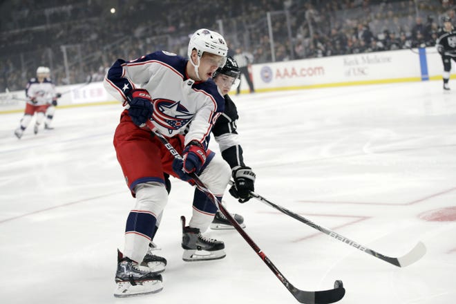 Markus Nutivaara is defended by the Los Angeles Kings' Ben Hutton during a Blue Jackets road game on Jan. 6.