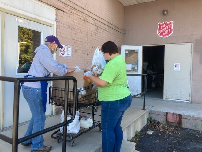 A client picks up food at The Salvation Army of Manitowoc County in Manitowoc.