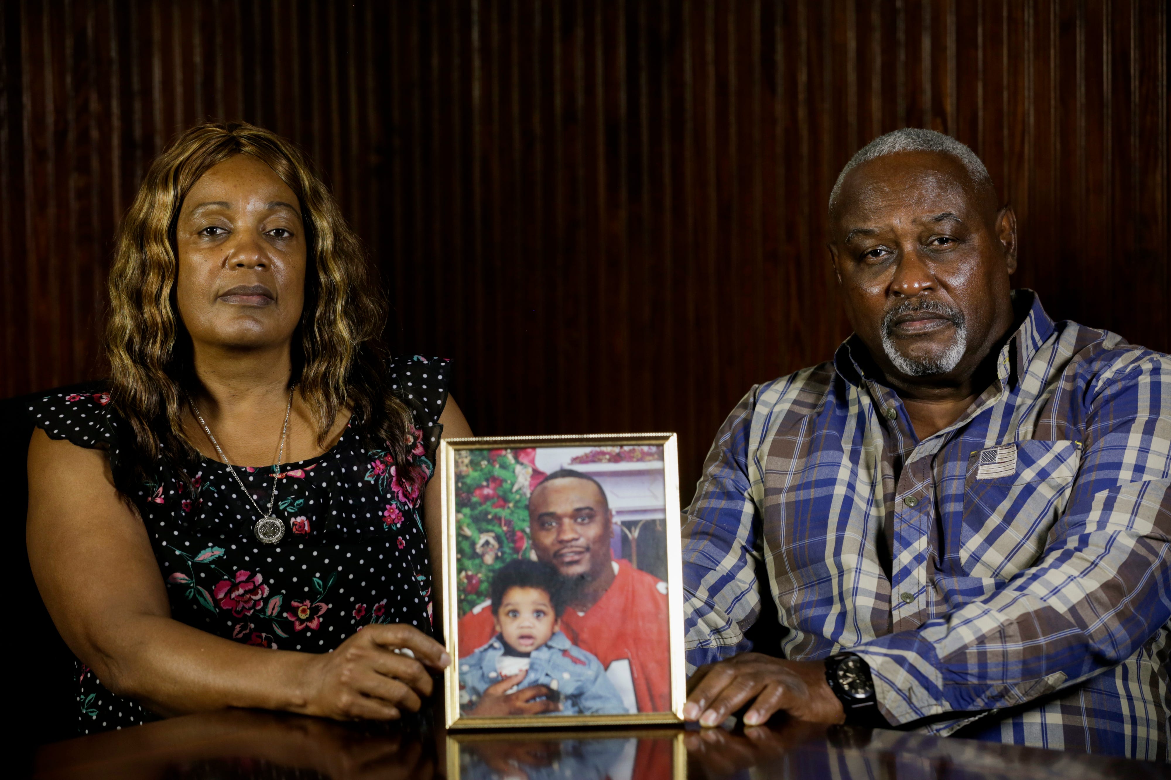 Maritza Ambler and husband Javier sit next to a photo of their son Javier Antonio Ambler II. On March 28, 2019, their son was stopped by a Williamson County Sheriff's deputy for not dimming his headlights. He was tased by two deputies when he did not immediately comply with verbal commands. Ambler died a few hours later, and autopsy concluded his death resulted from congestive heart failure in combination with forcible restraint.