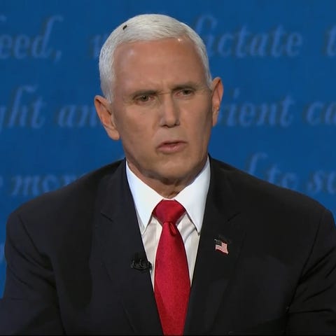 A fly that landed on Vice President Mike Pence's h