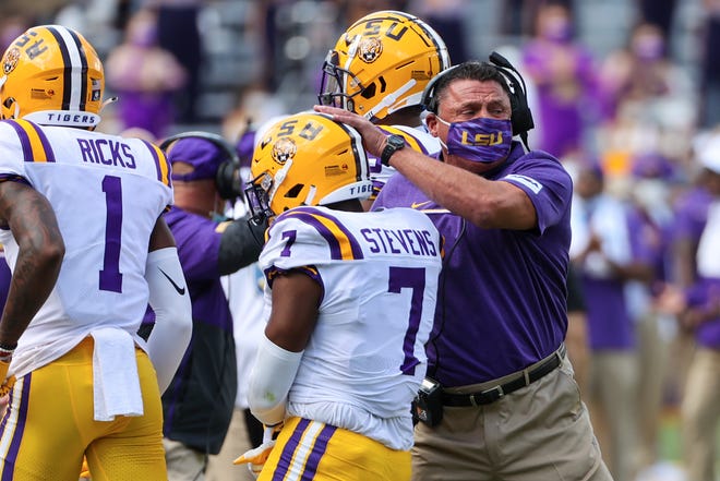 LSU head football coach Ed Orgeron celebrates with safety JaCoby Stevens (7) after a fumble recovery against Mississippi State on Sept. 26 at Tiger Stadium in Baton Rouge, La.