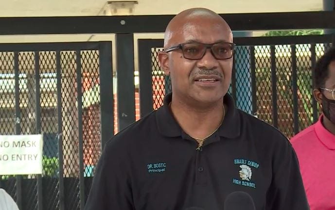 Ribault High School Principal Gregory Bostic addresses a campus shooting Friday.