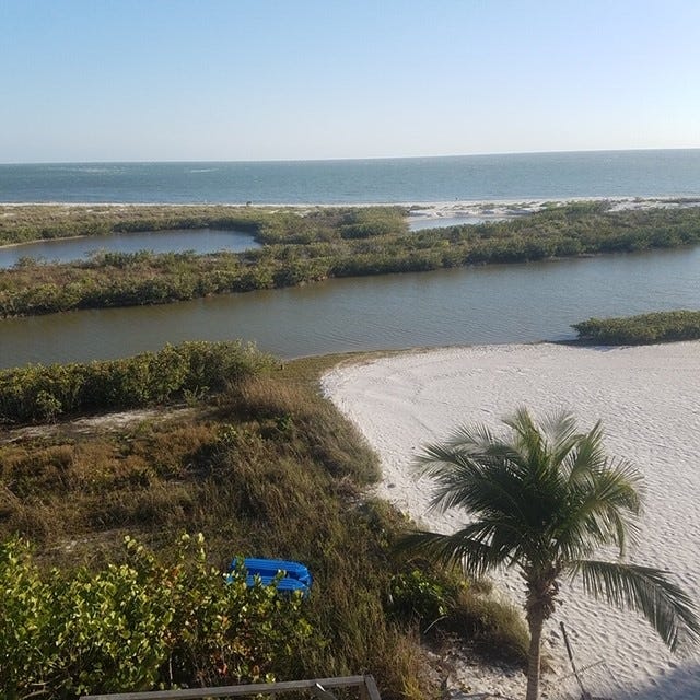 A view from the backyards of two Fort Myers Beach residents who are suing the state in hopes that it will allow them to build a walkover to the beach.