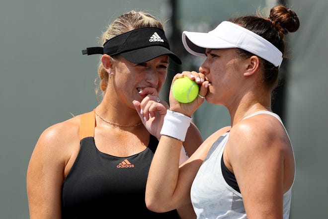 Desirae Krawczyk, a Palm Desert grad, talks to her partner Alexa Guarachi of Chile during a recent tournament. On Sunday, Krawczyk and Guarachi will play for the French Open championship, the first Grand Slam final in Krawczyk's career.