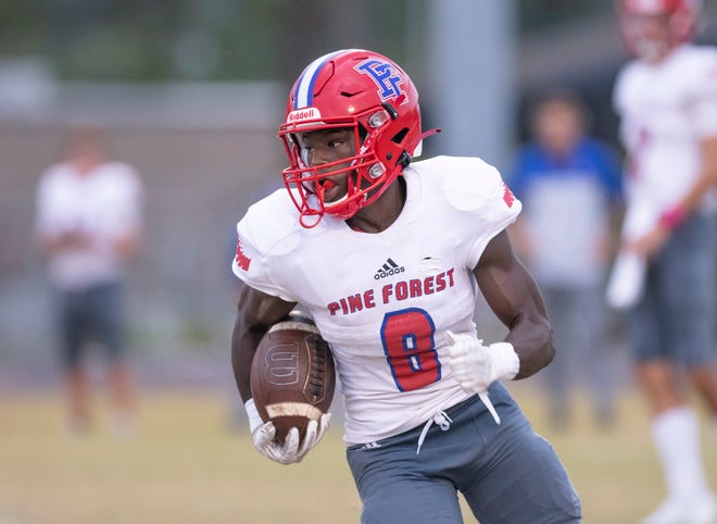 Joseph Garrett (8) carries the ball during the Pine Forest vs Washington football game at Booker T. Washington High School in Pensacola on Thursday, Oct. 8, 2020.