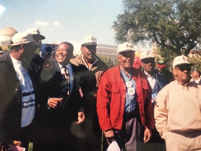 Charles Hicks (third from left) and his late father, Robert Hicks (third from right), gather with fellow union members during the Million Man March in 1995. Charles Hicks spoke at the march.