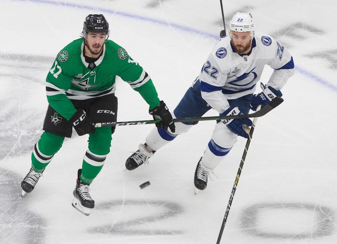 Tampa Bay Lightning defenseman Kevin Shattenkirk, right, and the Dallas Stars' Nick Caamano vie for the puck during the Stanley Cup Finals.