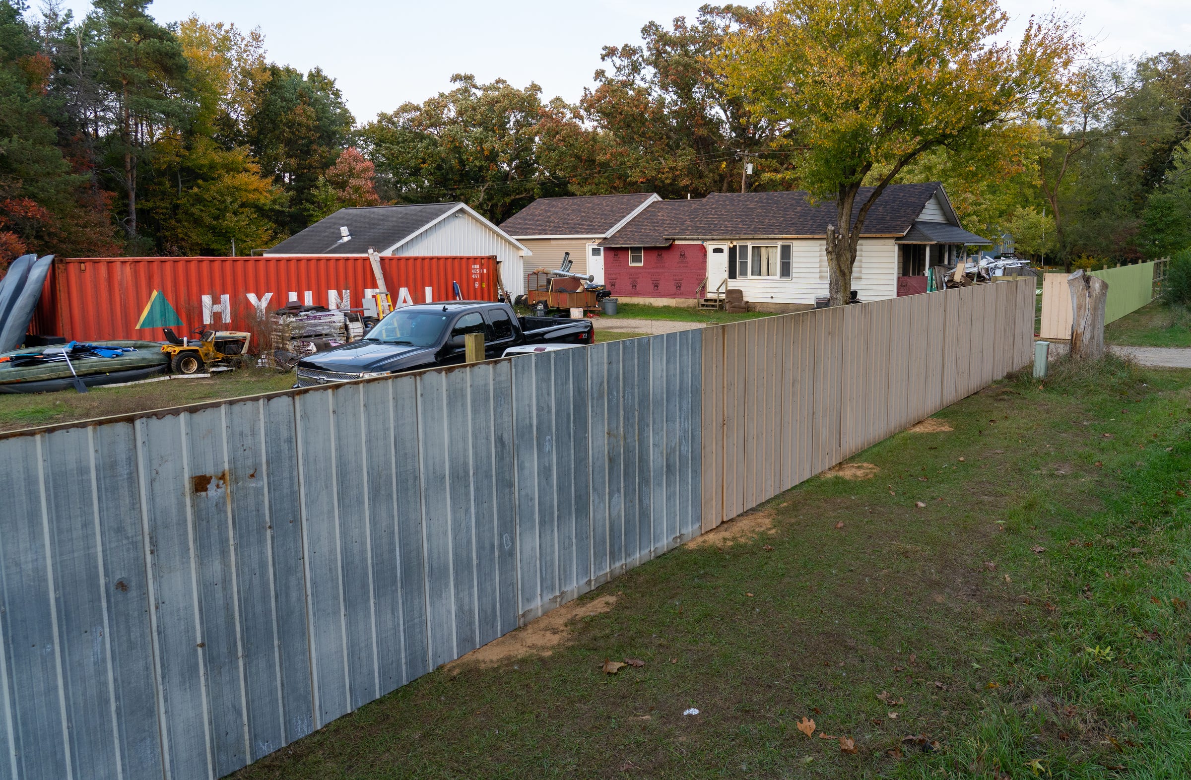 A wall recently constructed outside of the home of William Null in Shelbyville is seen outside of his home on Friday, October 9, 2020. Null is involved as part of 13 suspects accused of plotting to abduct and possibly harm Michigan Gov. Gretchen.