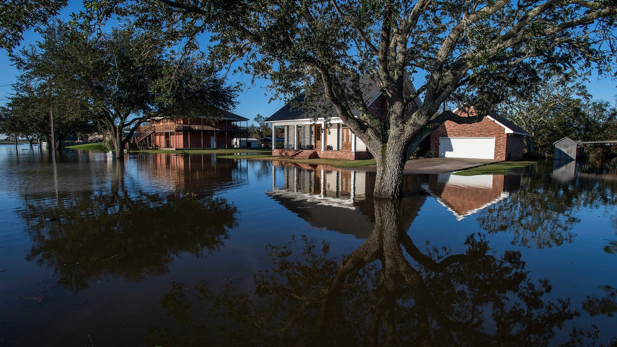 Flood waters surround houses in Delcambre, La., on Saturday Oct. 10, 2020 after Hurricane Delta hit the Louisiana Coast. 