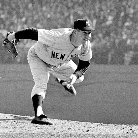 New York Yankees pitcher Whitey Ford pitches durin
