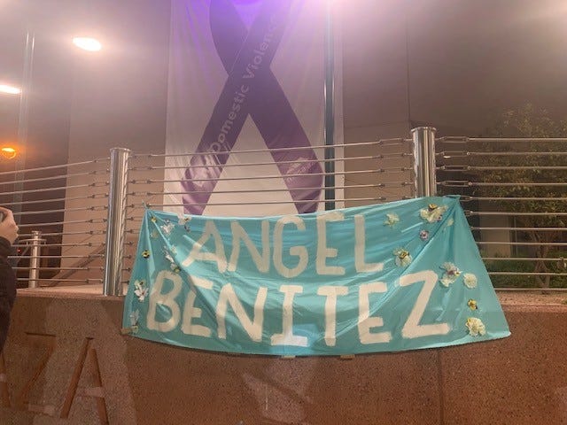 Attendees hung an "Angel Benitez" banner in front of Mesa City Hall on Saturday.