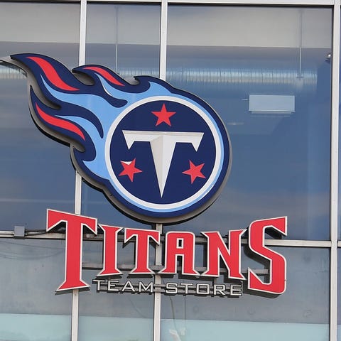 Tennessee Titans fans make their way in and out of
