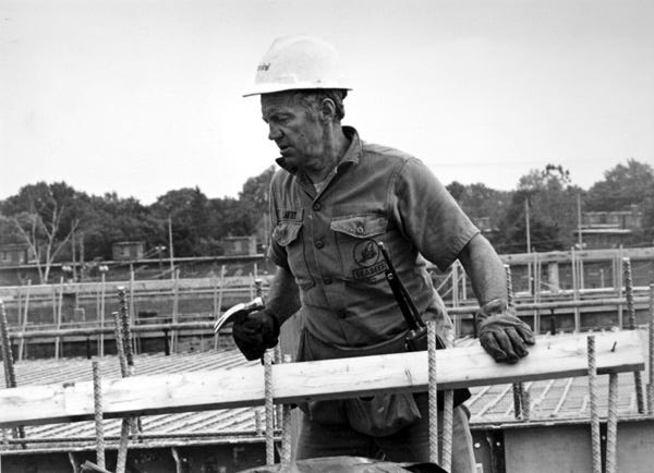 A construction worker, a member of the United Brotherhood of Carpenters and Joiners of America, Local 85, works on the 1990 project untangling the Can of Worms expressway intersection.