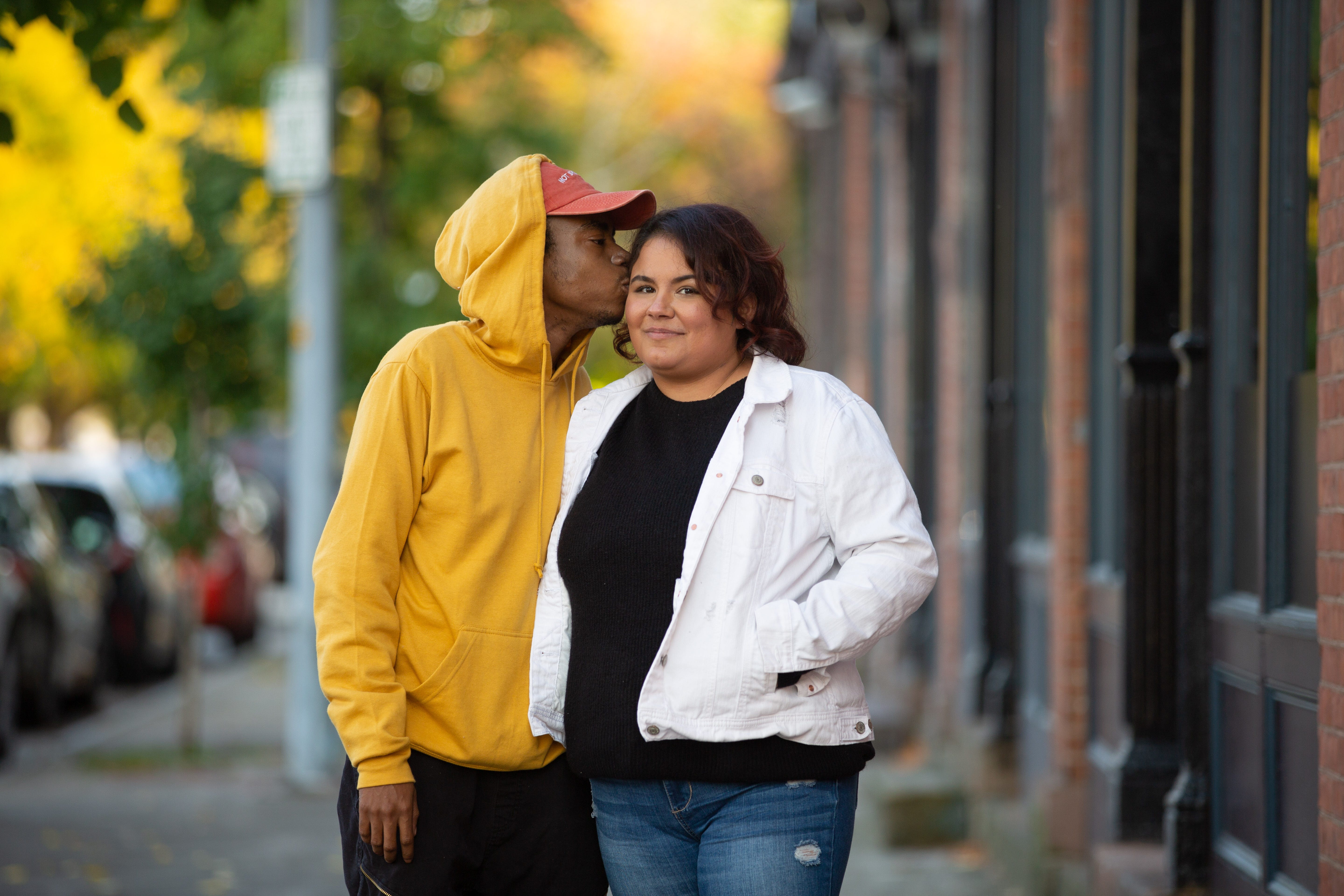 Shane Wilson, left, kisses his wife, Katt Wilson. Katt caught COVID-19 while working in a nursing home in May and was in a chemically induced coma for several weeks while her body fought off the virus.