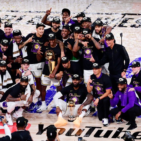 The Lakers celebrate after winning the 2020 NBA ch