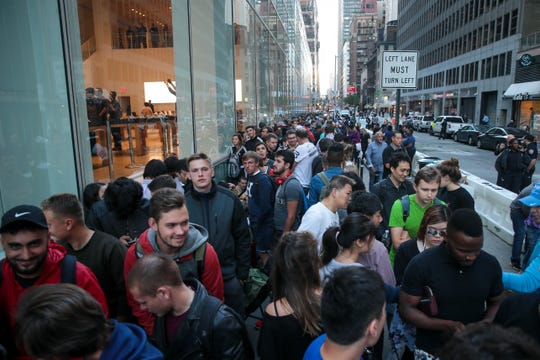 NEW YORK, NY - SEPTEMBER 22: Customers wait in line for the doors to open at the Fifth Avenue Apple Store, September 22, 2017 in New York City. The new iPhone 8 and iPhone 8 Plus, as well as the updated Apple Watch and Apple TV, went on sale.
