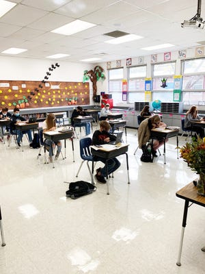Students sit and work silently in Mrs. Bourke's eighth grade classroom at Sisson School in Mount Shasta.