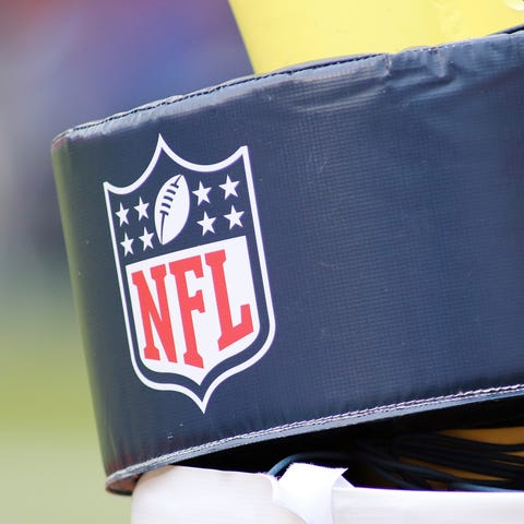 A close up an NFL football logo on a goalpost duri