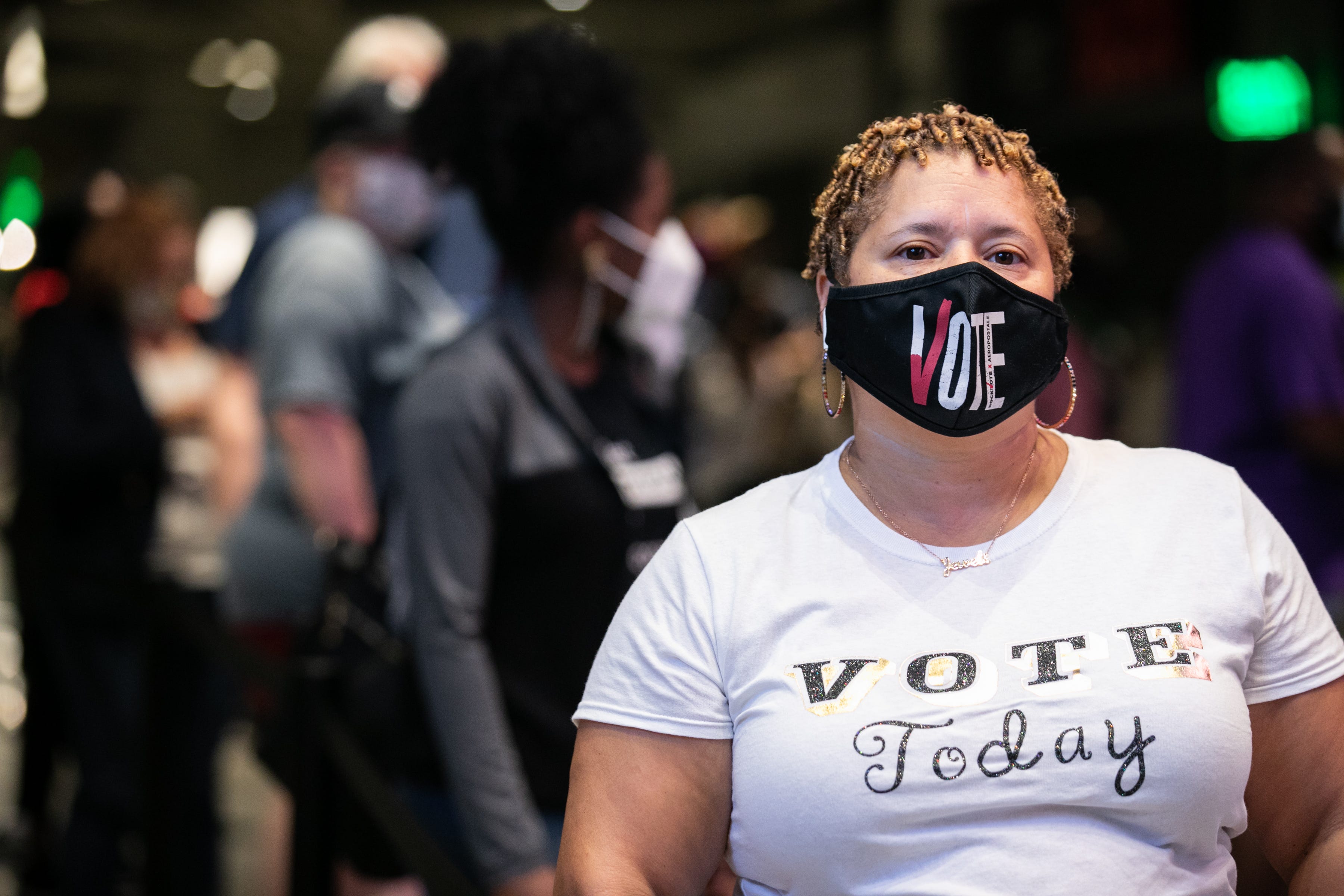 Heather King waits in line at State Farm Arena, Georgia's largest early voting location, to cast her ballot during the first day of early voting in the general election on Oct. 12, 2020 in Atlanta.