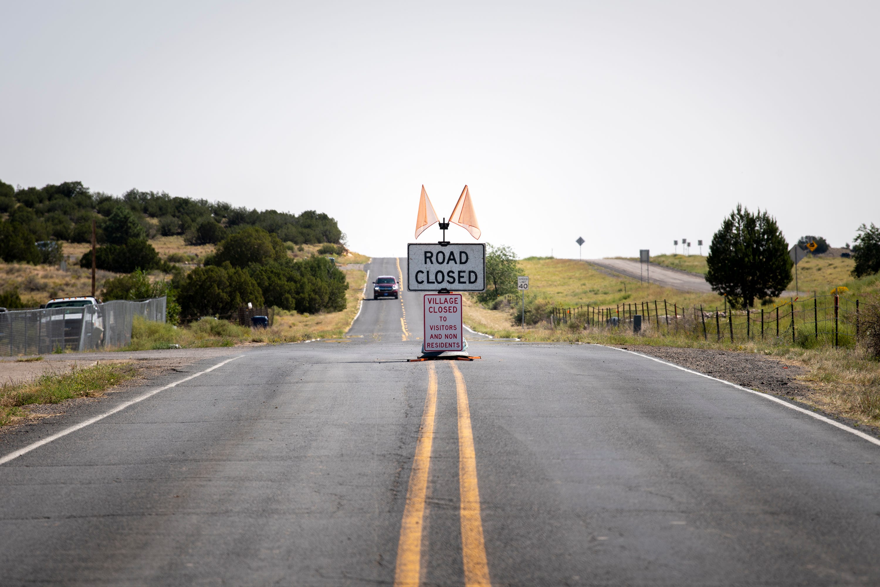 A road signs indicates that Laguna Pueblo is closed to visitors due to COVID-19 in Gallup, N.M.