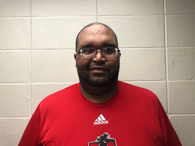 Assumption has named Henry Hollins as its interim boys basketball coach for the 2020-21 season.