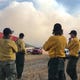 Cameron Peak Fire crews look out over a smoke plume near Stove Prairie on Wednesday, Oct. 14.