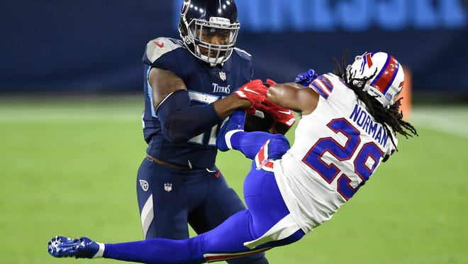 Derrick Henry tosses Josh Norman down during Bills-Titans game