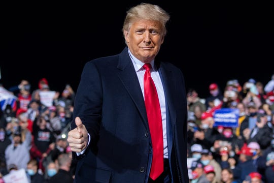 President Donald Trump gives a thumbs up as he arrives to hold a Make America Great Again rally as he campaigns at John Murtha Johnstown-Cambria County Airport in Johnstown, Pennsylvania, October 13, 2020.