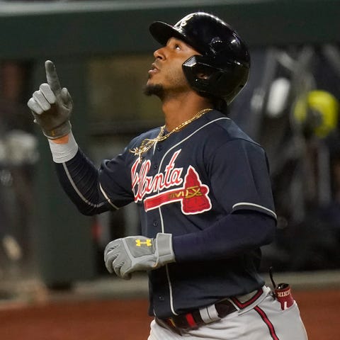 Ozzie Albies celebrates his ninth inning home run 