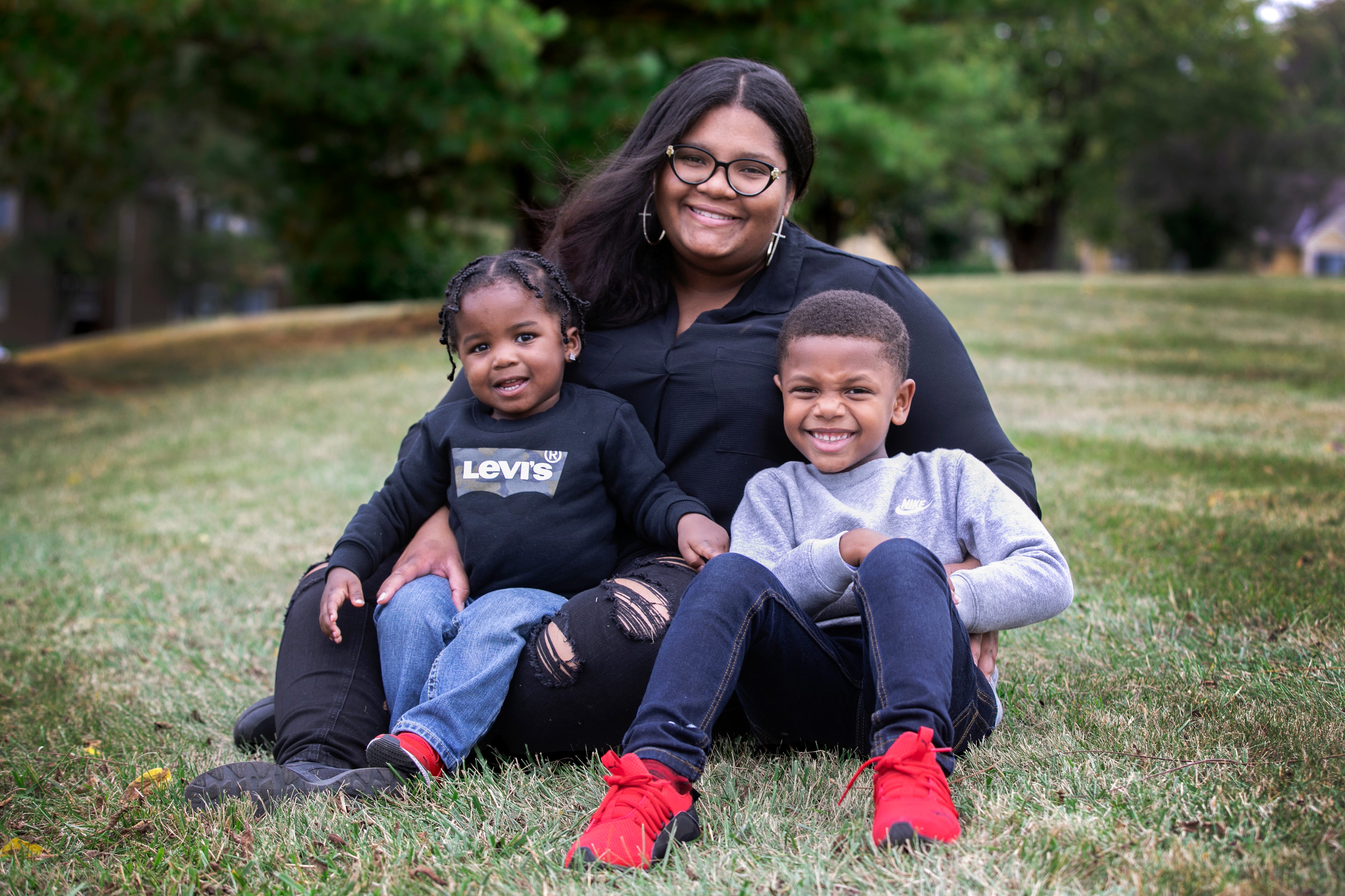 Courtney James with her children, Kairo Jackson, 2, and Judah White, 6, at their home in Fairfield on Sept. 30. The single mom, who is an OB-GYN nurse at UC West Chester, contracted COVID-19 in April. She still suffers some symptoms.