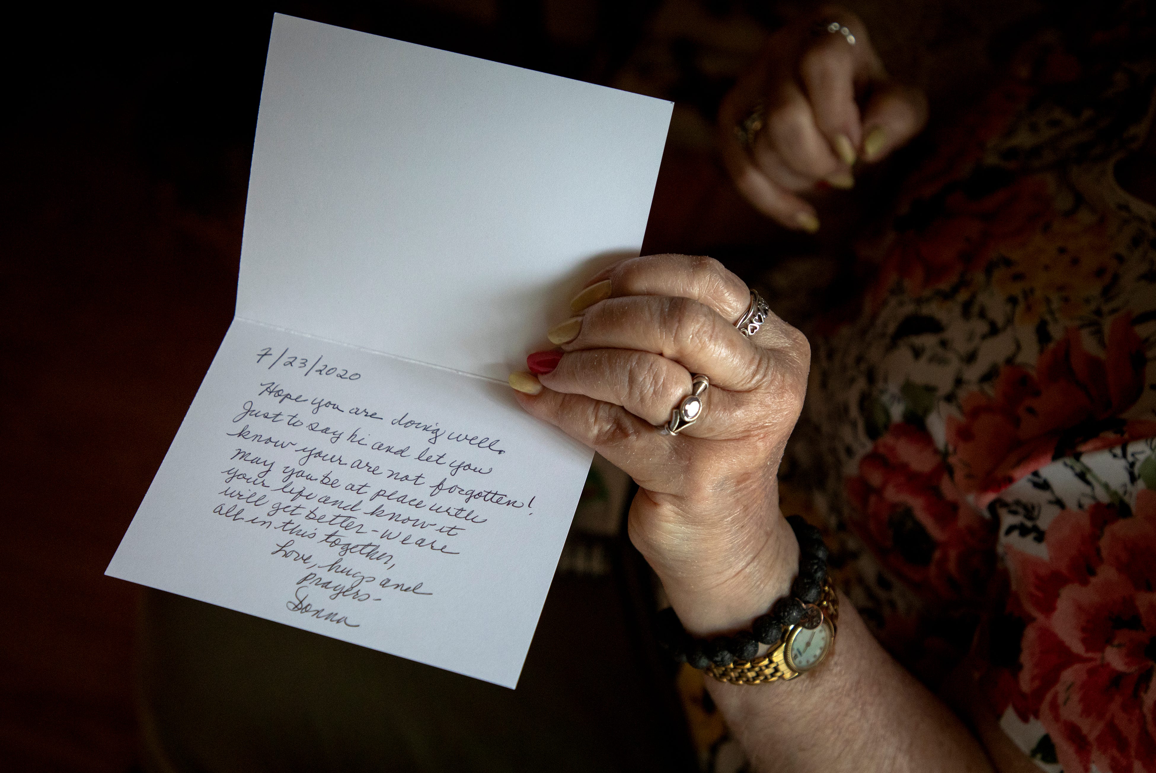 Donna Kinney, a cancer survivor who lives alone has stayed in her O’Bryonville apartment for most of this year to avoid the coronavirus. She spends time every week writing notes and mailing them to friends and acquaintances she can no longer see in person.