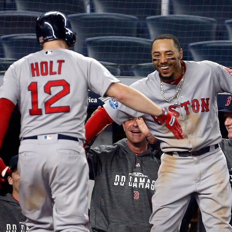 Boston Red Sox second baseman Brock Holt celebrate