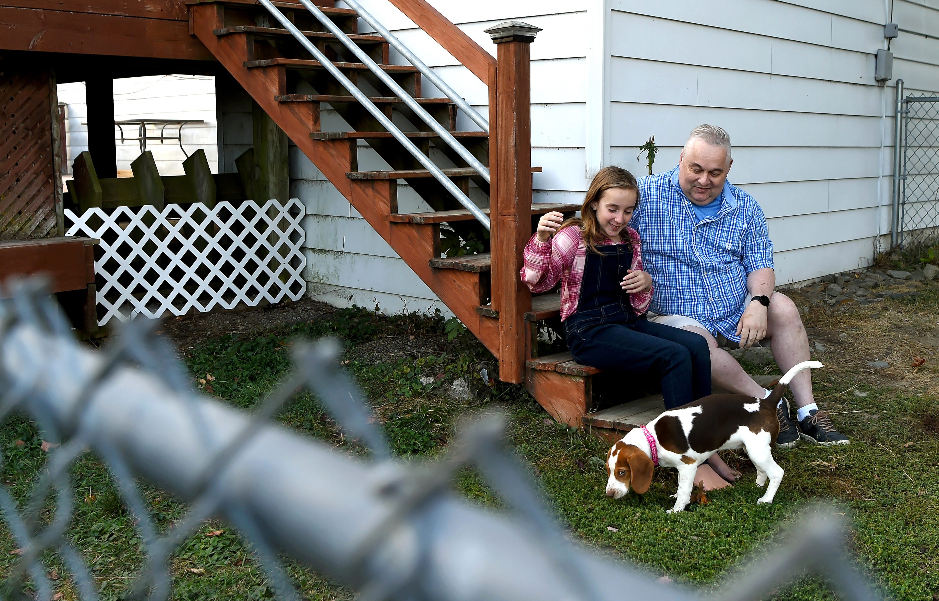 James Sova with his daughter Bella and puppy Daisy.