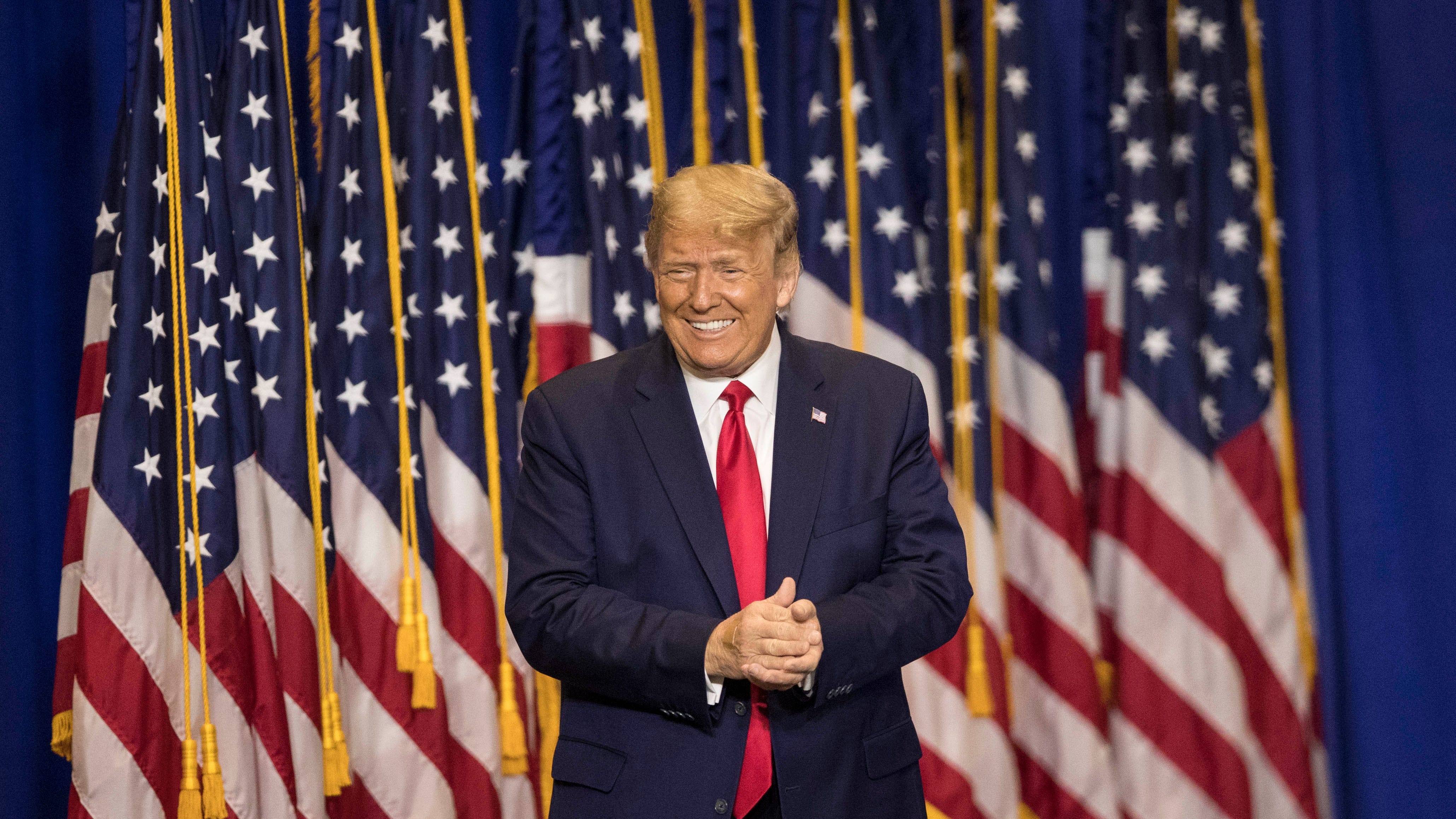 President Donald Trump enters the Caloosa Sound Convention Center and Amphitheater in downtown Fort Myers on Friday, October 16, 2020.